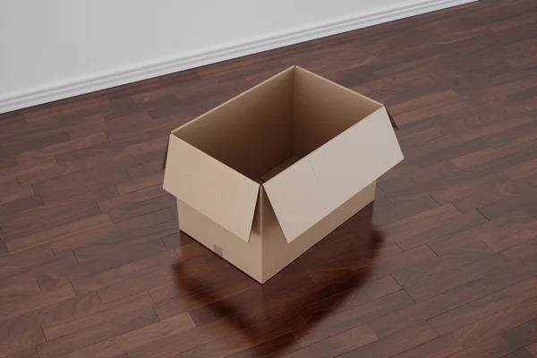 Κουτί από χαρτόνι στο άδειο δωμάτιο με σκούρα δάπεδο — Φωτογραφία Αρχείου