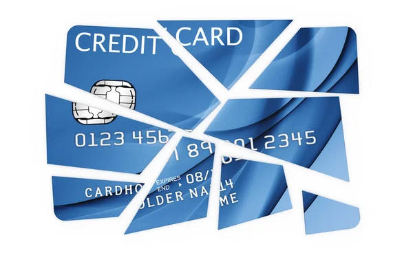 Кредитная карта разрезана на куски — стоковое фото