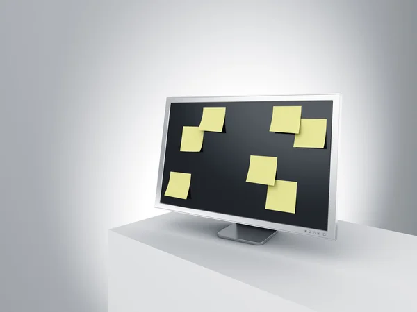 Monitor op een podium met post-it notities. — Stockfoto