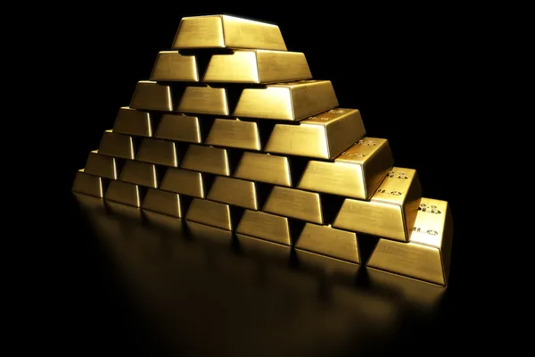 Goldbarren in einer Pyramide gestapelt — Stockfoto