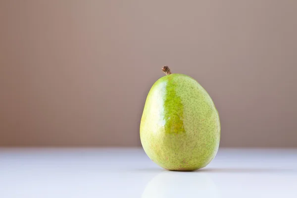 Green Pear on White with Brown Background — Stock Photo, Image