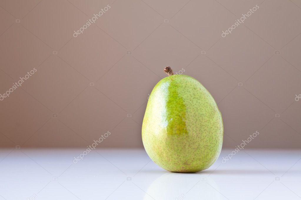 Green Pear on White with Brown Background