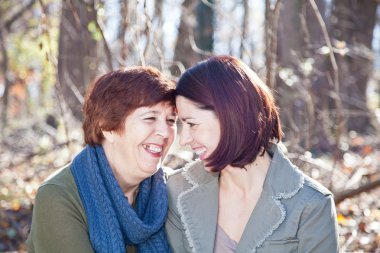 Portrait of Laughing Adult Mother and Daughter clipart