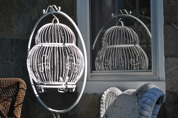 Antique bird cage in the sun — Zdjęcie stockowe