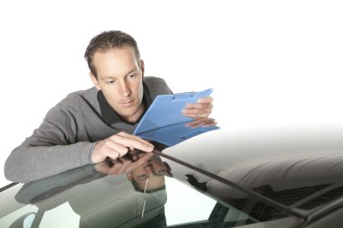 Insurance agent looking at a car clipart