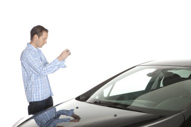 Man Taking Picture Of Car clipart