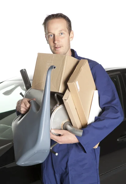 Mechanic Holding Cardboard Boxes And Oil Can — Stockfoto