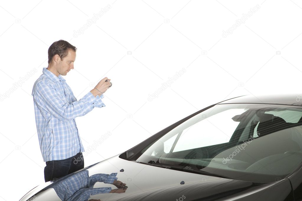 Man Taking Picture Of Car