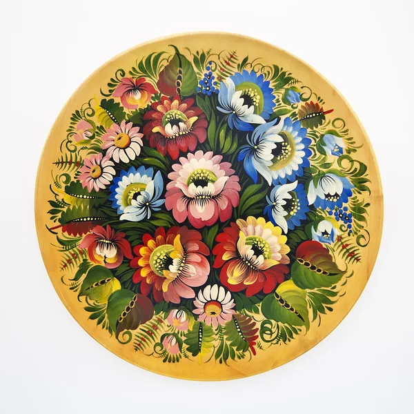 Floral decorative folk pattern on a wood dish on a white backgro — Stock Photo, Image