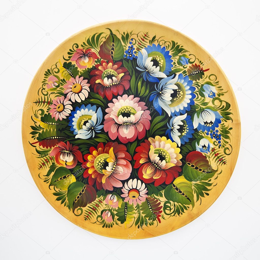 Floral decorative folk pattern on a wood dish on a white backgro