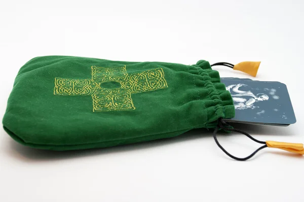 stock image Tarot pack in a green pouch with cross on it isolated