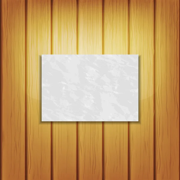 Tarjeta de papel en blanco sobre fondo de madera — Vector de stock