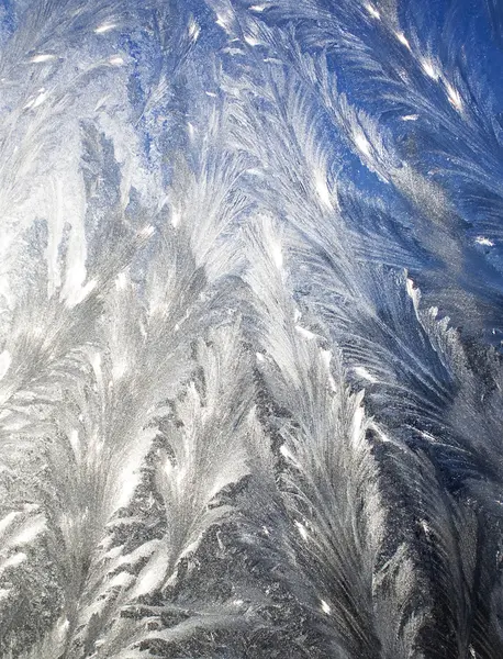 Frosty pattern at a window — Stock Photo, Image