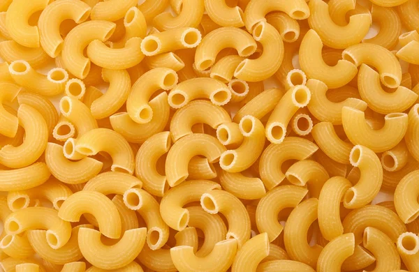 Raw macaroni background — Stock Photo, Image