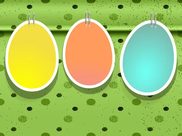 Пасхальные яйца на зеленом фоне — стоковый вектор