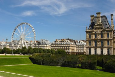 Park outside the Louvre in Paris. Ferris wheel at Jardin de Tuil clipart