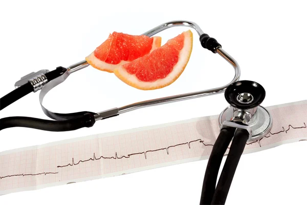 Phonendoskop und Kardiogramm mit Grapefruit — Stockfoto