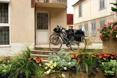 Tonnerre. Two bicycles at the entrance to the house clipart