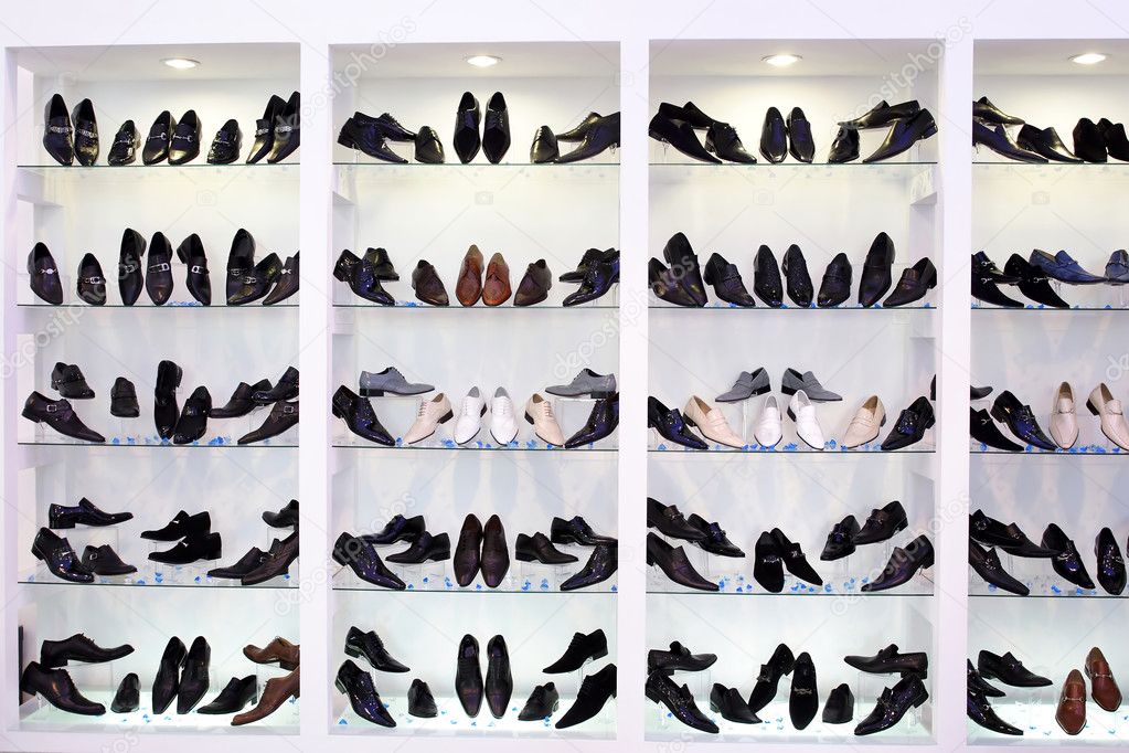 Men’s shoes on glass shelfs