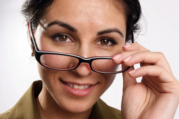 stock image Smiling woman looking through the glasses