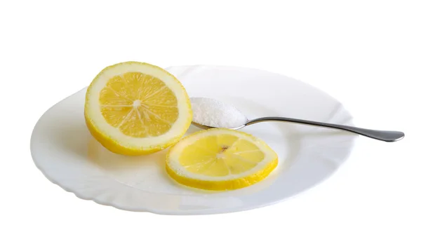 Лимон на тарілку — стокове фото