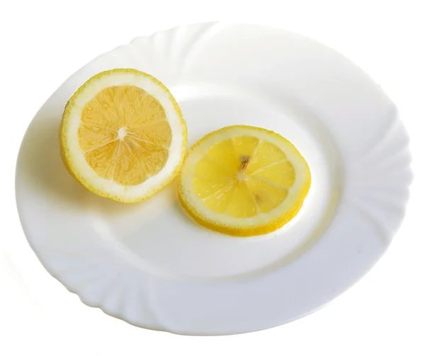 Limon på en tallrik Stockbild