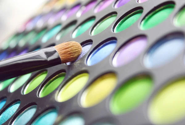 Color set of shades for a make-up of eyes with a brush — Stock Photo, Image