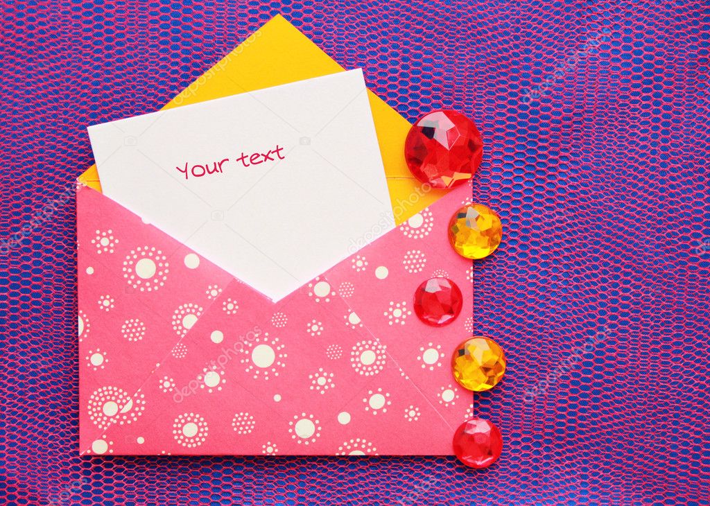 Pink envelope with white circles and a note