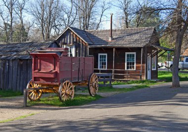 Old wagon in old town clipart