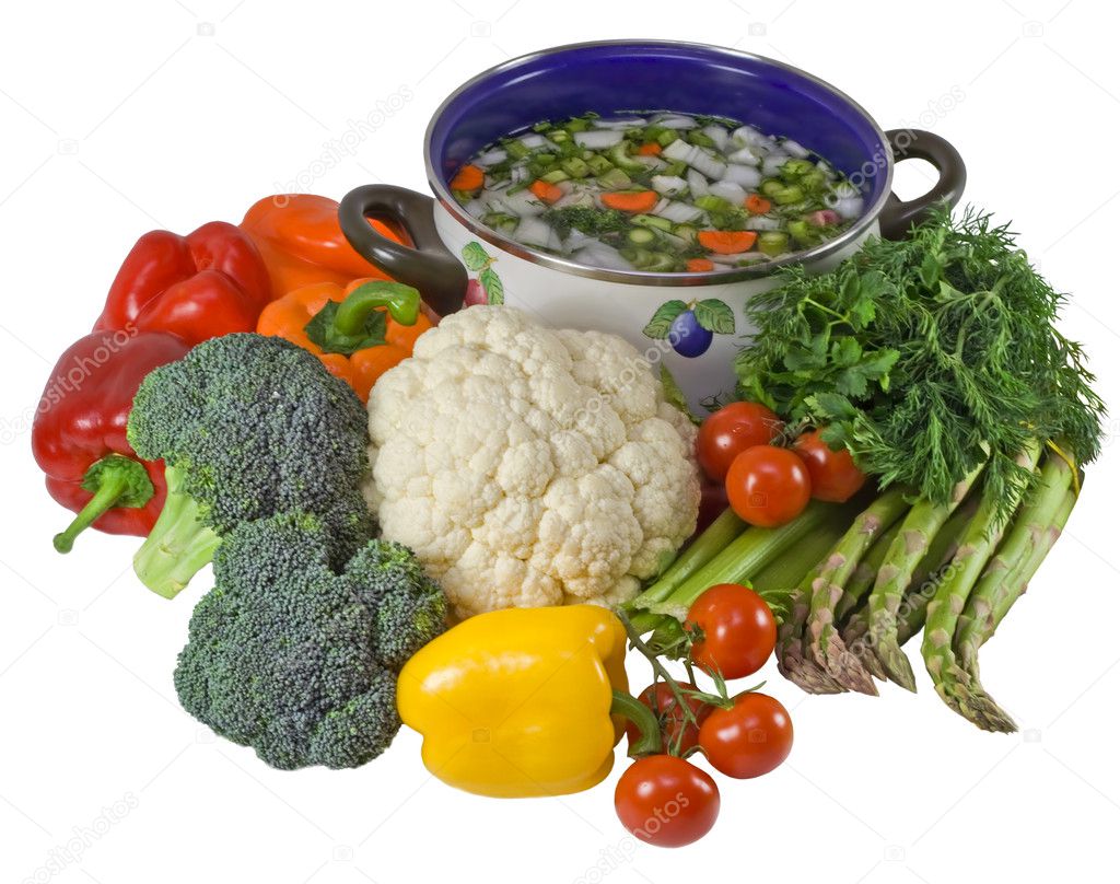 Vegetables and pot of soup.Isolated over white.