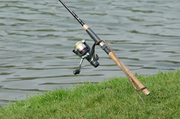 stock image France, a fishing rod by a pond