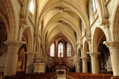 The interior of the church of Vigny in Val d Oise clipart