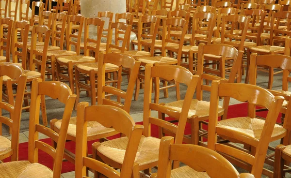 Wooden chairs in a French church — Stock Photo, Image