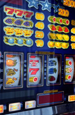 Slot machine in a casino clipart