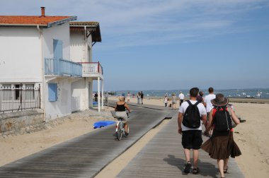 France, cyclist on a walkway in Arcachon clipart