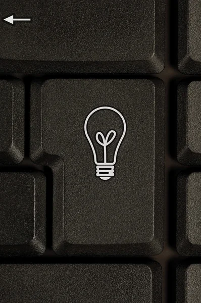 Symbol žárovky na klávesnici — Stock fotografie