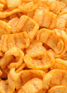 Close up of bacon andpaprika flavored snacks clipart