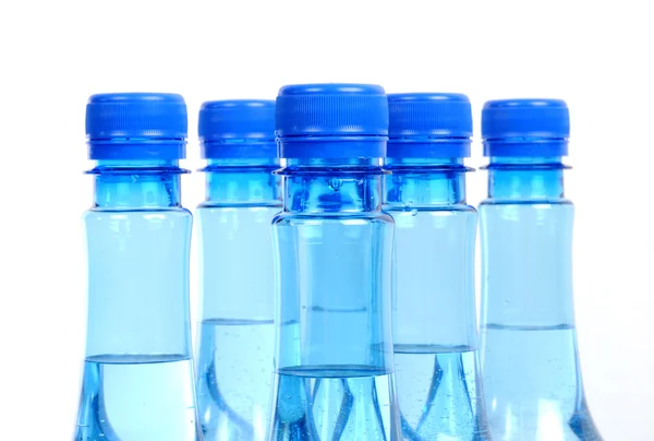 Close up of gas water bottles on a white background — Stock Photo, Image