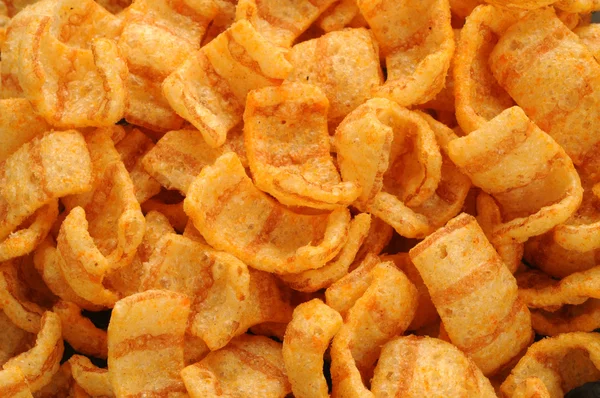 Close up of bacon andpaprika flavored snacks — Stock Photo, Image