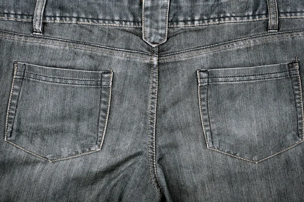 Ткань серых джинсов с карманами — стоковое фото