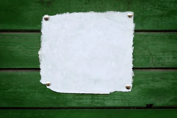 Närbild av handgjorda Obs papper på trä bakgrund — Stockfoto