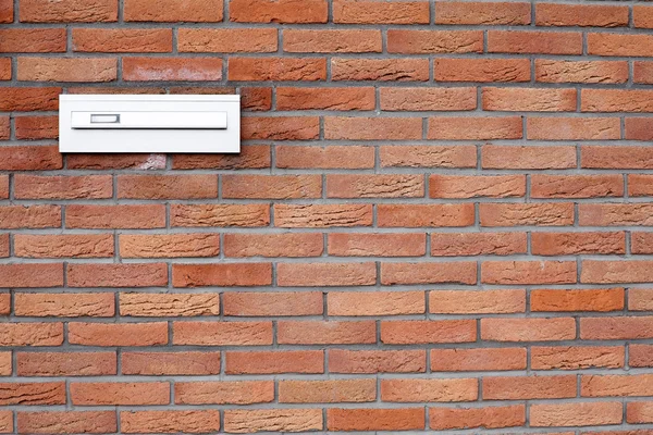 Mailbox in a brick wall — Stock Photo, Image