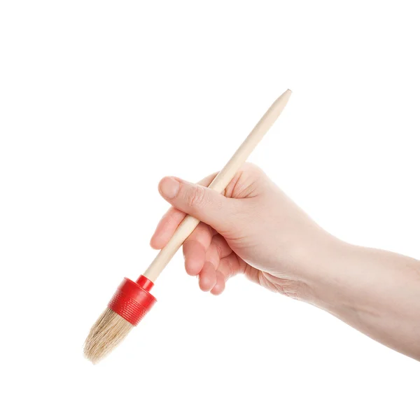Hand with a brush — Stock Photo, Image