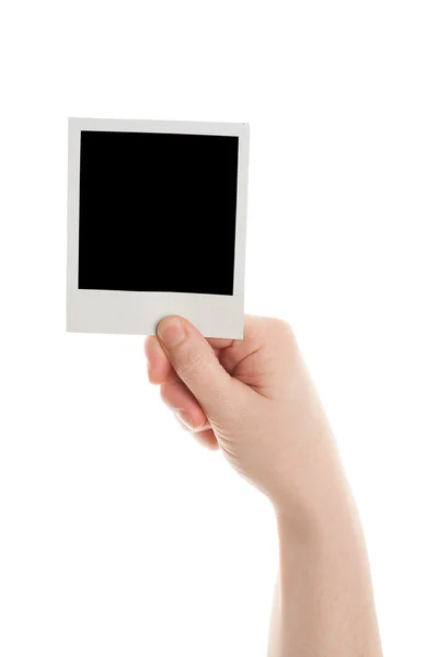 One instant photo in hand — Stock Photo, Image