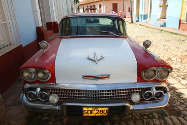 Old car on the streets of trinidad clipart