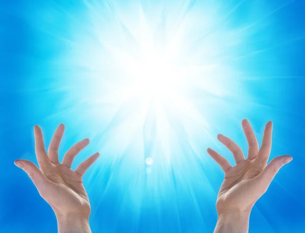 Hands and sun on blu background — Stock Photo, Image