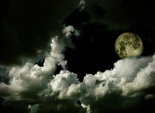 Full moon with clouds and stars Stock Photo