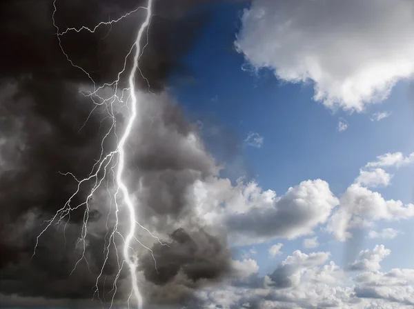 stock image Blue sunny sky and black clouds with lightning