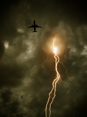 Yellow tone cloudy sky with lightning and flying plane clipart