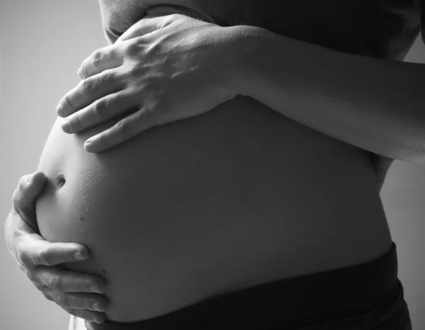 Pregnant belly black and white — Stock Photo, Image